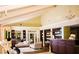 Elegant reception area with comfortable seating, dark wood bookshelves and a chandelier in a bright and airy space at 36750 Us Highway 19 N # 01205, Palm Harbor, FL 34684