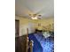 Bedroom featuring a brass bed frame, wood floors and a white closet door at 38339 Eucalyptus Dr, Zephyrhills, FL 33542