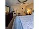 Primary bedroom featuring a ceiling fan, a large bed and carpet floors at 38339 Eucalyptus Dr, Zephyrhills, FL 33542