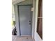 Exterior door providing access to storage or utility area, adding convenience and functionality to the home at 38339 Eucalyptus Dr, Zephyrhills, FL 33542