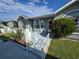 Close exterior view highlighting the home's entrance, beautiful landscaping, and architectural details at 38339 Eucalyptus Dr, Zephyrhills, FL 33542