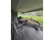 Charming covered patio with seating and views of the surrounding landscape, creating a relaxing outdoor space at 38339 Eucalyptus Dr, Zephyrhills, FL 33542