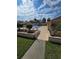 Inviting community pool surrounded by well-manicured landscaping, perfect for relaxation and leisure activities at 38339 Eucalyptus Dr, Zephyrhills, FL 33542