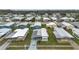 Aerial view of a well-maintained residential community with lush landscaping at 3834 Kim Dr, Wesley Chapel, FL 33543