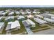 Aerial view of a well-maintained residential community with lush landscaping at 3834 Kim Dr, Wesley Chapel, FL 33543