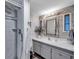 Bathroom featuring a modern vanity, stylish mirror, and tiled shower for a spa-like experience at 3834 Kim Dr, Wesley Chapel, FL 33543