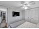 Bedroom featuring a flat screen television, ceiling fan, and closet at 3834 Kim Dr, Wesley Chapel, FL 33543