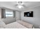 Bedroom with one window, flat screen television, and ceiling fan at 3834 Kim Dr, Wesley Chapel, FL 33543