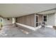 Spacious covered carport with a screened-in porch and room for parking and outdoor seating at 3834 Kim Dr, Wesley Chapel, FL 33543