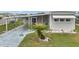 Charming single-story home with carport, well-maintained lawn, and palm tree at 3834 Kim Dr, Wesley Chapel, FL 33543