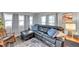 Spacious living room featuring a comfortable sectional sofa and lots of natural light at 3834 Kim Dr, Wesley Chapel, FL 33543