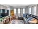 Bright living room with hardwood floors, comfortable seating, and lots of natural light at 3834 Kim Dr, Wesley Chapel, FL 33543