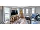 Bright living room with hardwood floors, comfortable seating, and lots of natural light at 3834 Kim Dr, Wesley Chapel, FL 33543