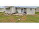 Exterior view of the property featuring a covered porch and door at 3834 Kim Dr, Wesley Chapel, FL 33543
