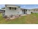 Exterior view of the property featuring a covered porch and door at 3834 Kim Dr, Wesley Chapel, FL 33543