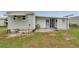 Exterior view of the property featuring a covered porch and door at 3834 Kim Dr, Wesley Chapel, FL 33543