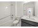 Modern bathroom with white subway tiles in shower and black vanity at 408 W Paris St, Tampa, FL 33604