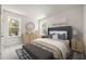 Well-lit bedroom with a large bed, two windows and tasteful decor at 408 W Paris St, Tampa, FL 33604