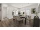 Dining room with dark wood table, seating for six, chandelier, and windows at 408 W Paris St, Tampa, FL 33604