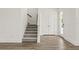 Bright entryway featuring wood floors, a staircase, and a white front door with glass panel at 408 W Paris St, Tampa, FL 33604