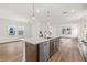Modern kitchen island with stainless steel appliances, granite countertops, and pendant lighting at 408 W Paris St, Tampa, FL 33604