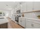 Contemporary kitchen with white cabinetry, stainless steel appliances, and a center island at 408 W Paris St, Tampa, FL 33604