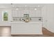 Bright kitchen with a center island, white cabinetry, and modern stainless steel appliances at 408 W Paris St, Tampa, FL 33604