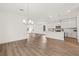Open floor plan with modern kitchen, sleek cabinetry, and spacious dining and living areas at 408 W Paris St, Tampa, FL 33604
