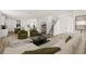 Bright living room featuring modern furniture and an open floor plan leading to the kitchen and dining area at 408 W Paris St, Tampa, FL 33604