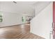Open-concept living room flows to kitchen with light wood floors and natural light at 408 W Paris St, Tampa, FL 33604