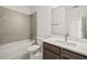 A guest bathroom with a combination tub and shower at 410 W Paris St, Tampa, FL 33604