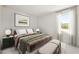 A staged bedroom with a large window at 410 W Paris St, Tampa, FL 33604