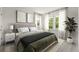 A staged bedroom with a large window at 410 W Paris St, Tampa, FL 33604