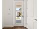 An entryway has white doors with views of the backyard at 410 W Paris St, Tampa, FL 33604
