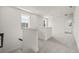 Upstairs landing with soft carpet, natural light and views to the outside; bright and airy at 410 W Paris St, Tampa, FL 33604