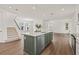 Bright, open kitchen featuring a large center island with a quartz countertop and stainless steel appliances at 410 W Paris St, Tampa, FL 33604