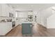 Modern kitchen boasts a green island, stainless appliances, and white cabinets in an open layout at 410 W Paris St, Tampa, FL 33604