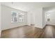 Bright living room with large windows, hardwood floors, and neutral color scheme for versatile decorating at 410 W Paris St, Tampa, FL 33604