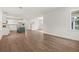 Bright and airy open living area showcasing wood floors and a view of the modern kitchen at 410 W Paris St, Tampa, FL 33604