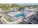 Aerial view featuring the community pool, shuffleboard court, and meticulously maintained grounds at 4851 W Gandy Blvd # B3L35, Tampa, FL 33611
