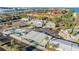 Aerial view of community amenities, including a pool, clubhouse, and shuffleboard court at 4851 W Gandy Blvd # B3L35, Tampa, FL 33611