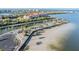 Aerial view showcasing waterfront community with palm trees, walkways, and coastal homes at 4851 W Gandy Blvd # B3L35, Tampa, FL 33611