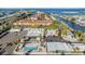 Scenic aerial view of community featuring waterfront access, pool, clubhouse, and convenient parking at 4851 W Gandy Blvd # B3L35, Tampa, FL 33611