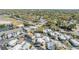 Aerial view of a vibrant mobile home community with lush landscaping, palm trees, and well-maintained streets near the water at 4851 W Gandy Blvd # B3L35, Tampa, FL 33611