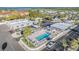 Aerial view showcasing the community pool area, shuffleboard courts and beautifully maintained landscaping at 4851 W Gandy Blvd # B3L35, Tampa, FL 33611