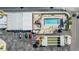 Aerial view of the community pool, hot tub, shuffle board court, and parking area at 4851 W Gandy Blvd # B3L35, Tampa, FL 33611