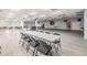 Large, well-lit banquet hall with laminate floors, ceiling fans, and folding tables and chairs at 4851 W Gandy Blvd # B3L35, Tampa, FL 33611