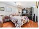 Charming bedroom features updated wood floors, natural light, closet, and stylish furnishings at 4851 W Gandy Blvd # B3L35, Tampa, FL 33611