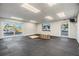Spacious recreation room featuring rubber flooring, bright lighting, and convenient sliding door access at 4851 W Gandy Blvd # B3L35, Tampa, FL 33611