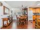 Charming dining area with wood flooring, a dining table, and a view of the kitchen at 4851 W Gandy Blvd # B3L35, Tampa, FL 33611